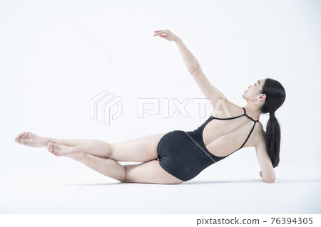 contemporary Asian female dancer making move in white background contemporary Asian female dancer making move in white background 76394305