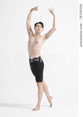 contemporary asian male dancer making move in white background contemporary asian male dancer making move in white background 76394306