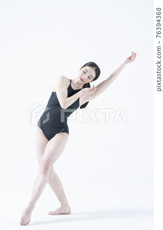 contemporary Asian female dancer making move in white background contemporary Asian female dancer making move in white background 76394368