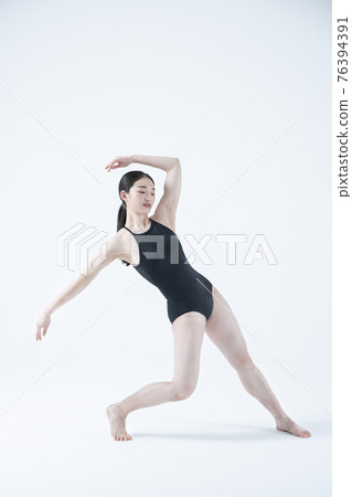 contemporary Asian female dancer making move in white background contemporary Asian female dancer making move in white background 76394391