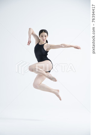 contemporary Asian female dancer making move in white background contemporary Asian female dancer making move in white background 76394417