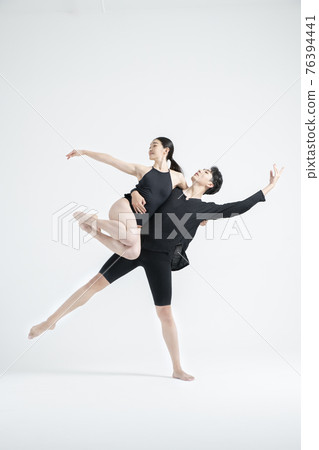 male and female couple modern contemporary dancers making moves in white background setting male and female couple modern contemporary dancers making moves in white background setting 76394441