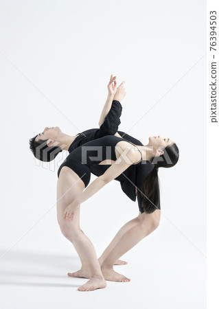 male and female couple modern contemporary dancers making moves in white background setting male and female couple modern contemporary dancers making moves in white background setting 76394503