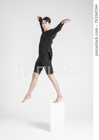 contemporary asian male dancer making move in white background contemporary asian male dancer making move in white background 76394594