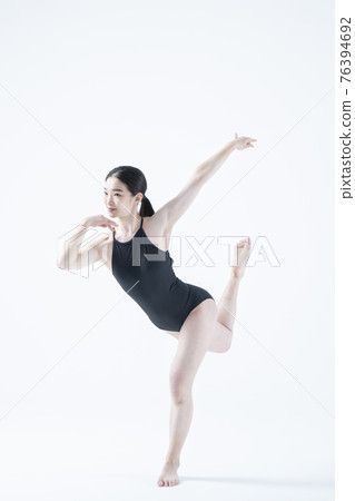 contemporary Asian female dancer making move in white background contemporary Asian female dancer making move in white background 76394692