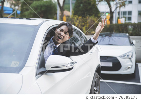 angry Asian male in suit in the car angry Asian male in suit in the car 76395173