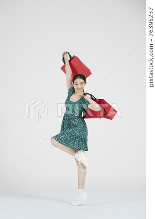 sale promotion concept, contemporary female dancer with shopping gift box sale promotion concept, contemporary female dancer with shopping gift box 76395237