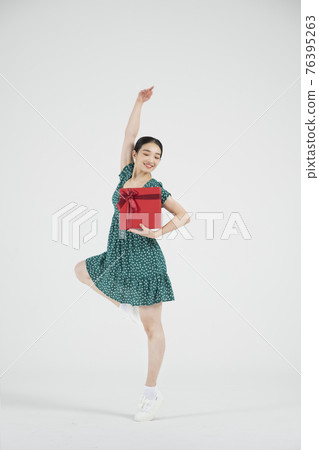 sale promotion concept, contemporary female dancer with shopping gift box sale promotion concept, contemporary female dancer with shopping gift box 76395263