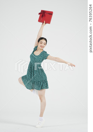 sale promotion concept, contemporary female dancer with shopping gift box sale promotion concept, contemporary female dancer with shopping gift box 76395264