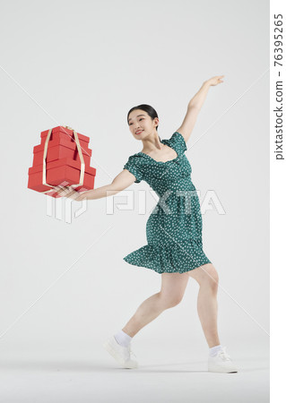 sale promotion concept, contemporary female dancer with shopping gift box sale promotion concept, contemporary female dancer with shopping gift box 76395265