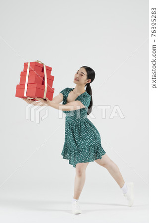 sale promotion concept, contemporary female dancer with shopping gift box sale promotion concept, contemporary female dancer with shopping gift box 76395283