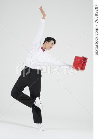 sale promotion concept, contemporary male dancer with shopping gift box sale promotion concept, contemporary male dancer with shopping gift box 76395287