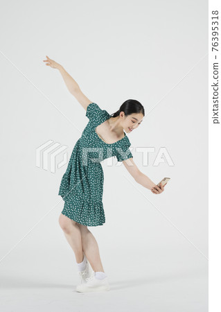 sale promotion concept, contemporary female dancer with smarphone on hand sale promotion concept, contemporary female dancer with smarphone on hand 76395318