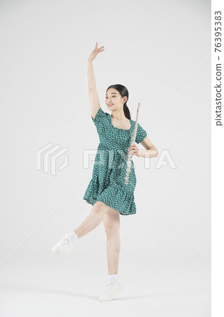 Asian female contemporary dancer with flute Asian female contemporary dancer with flute 76395383