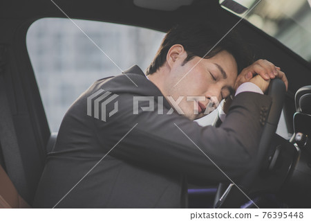 angry Asian male in suit sleeping, taking a nap in the car angry Asian male in suit sleeping, taking a nap in the car 76395448
