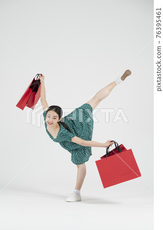 sale promotion concept, contemporary female dancer with shopping gift box sale promotion concept, contemporary female dancer with shopping gift box 76395461