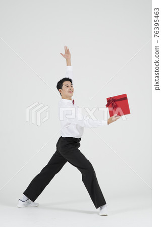 sale promotion concept, contemporary male dancer with shopping gift box sale promotion concept, contemporary male dancer with shopping gift box 76395463