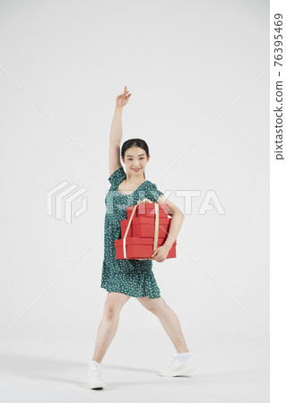 sale promotion concept, contemporary female dancer with shopping gift box sale promotion concept, contemporary female dancer with shopping gift box 76395469