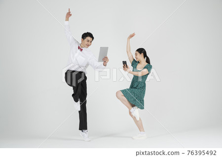 Asian couple contemporary dancers holding speech bubble copyspace Asian couple contemporary dancers holding speech bubble copyspace 76395492