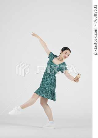sale promotion concept, contemporary female dancer with smarphone on hand sale promotion concept, contemporary female dancer with smarphone on hand 76395532