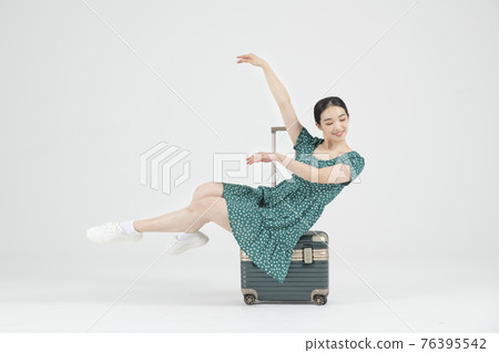 Asian female contemporary dancer with travel bag Asian female contemporary dancer with travel bag 76395542