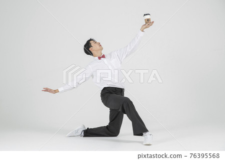 Asian male contemporary dancer with coffee 76395568