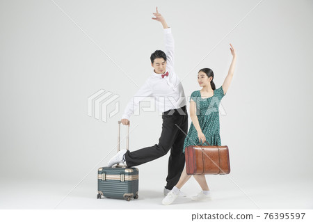 Asian couple contemporary dancers with travel bag Asian couple contemporary dancers with travel bag 76395597