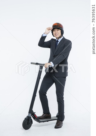 man riding electric scooter to work, white background 76395631