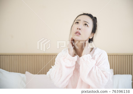 sick Asian woman in bed sick Asian woman in bed 76396138