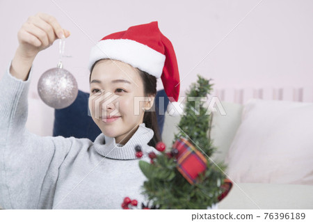 Asian single solo woman living alone concept having Christmas party Asian single solo woman living alone concept having Christmas party 76396189