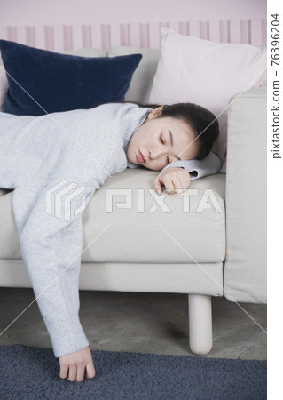 bored Asian single solo woman living alone concept bored Asian single solo woman living alone concept 76396204