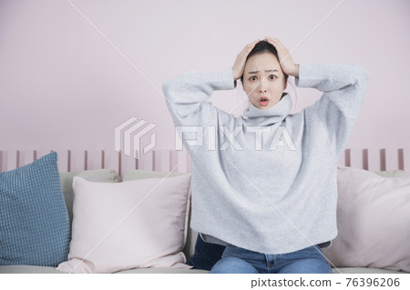 surprised Asian single solo woman living alone concept surprised Asian single solo woman living alone concept 76396206