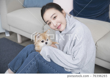 Asian single solo woman living alone concept with pet dog Asian single solo woman living alone concept with pet dog 76396265