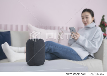 Asian single solo woman living alone concept using artificial intelligence speaker Asian single solo woman living alone concept using artificial intelligence speaker 76396367