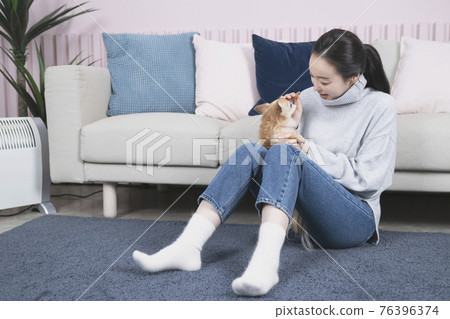 Asian single solo woman living alone concept with pet dog 76396374