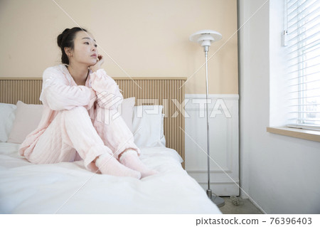 sick Asian woman in bed sick Asian woman in bed 76396403