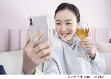 Asian single solo woman enjoying home alone time concept Asian single solo woman enjoying home alone time concept 76396460