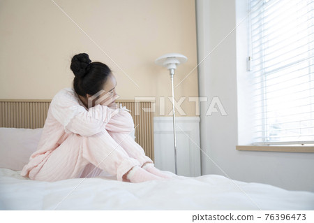 sick Asian woman in bed sick Asian woman in bed 76396473