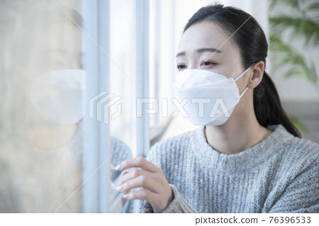 depressed Asian woman wearing mask depressed Asian woman wearing mask 76396533