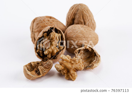 walnuts on white background walnuts on white background 76397113