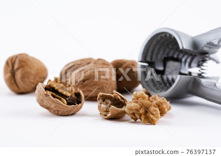 walnuts and nutcracker 76397137