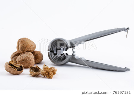 walnuts and nutcracker 76397181