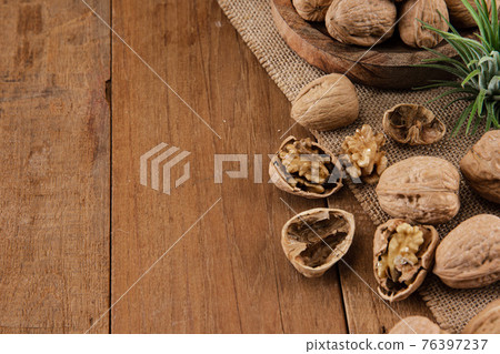 walnut kernels and whole walnuts walnut kernels and whole walnuts 76397237