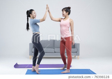 two fit Asian young women home training concept wearing sports top