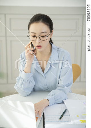 remote work, working at home concept of Asian woman in smart casual attire remote work, working at home concept of Asian woman in smart casual attire 76398395