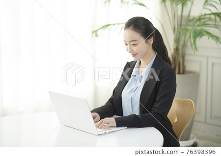 remote work, working at home concept of Asian woman in smart casual attire remote work, working at home concept of Asian woman in smart casual attire 76398396