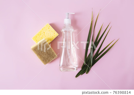Soap dropper, dishwashing liquid, dish soap, washcloth. Pink, yellow background Soap dropper, dishwashing liquid, dish soap, washcloth. Pink, yellow background 76398814