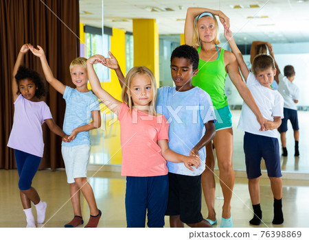 Little boys and girls dancing pair dance in the ballet studio Little boys and girls dancing pair dance in the ballet studio 76398869