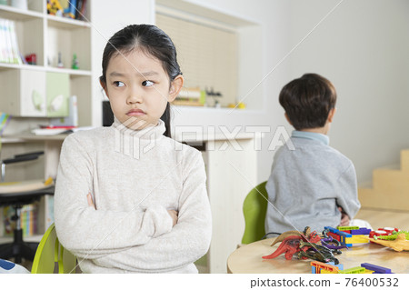 Asian girl and boy, sister and brother fighting over toy Asian girl and boy, sister and brother fighting over toy 76400532
