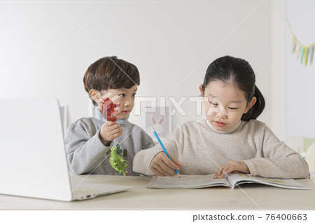 Asian boy disrupting sister from studying Asian boy disrupting sister from studying 76400663